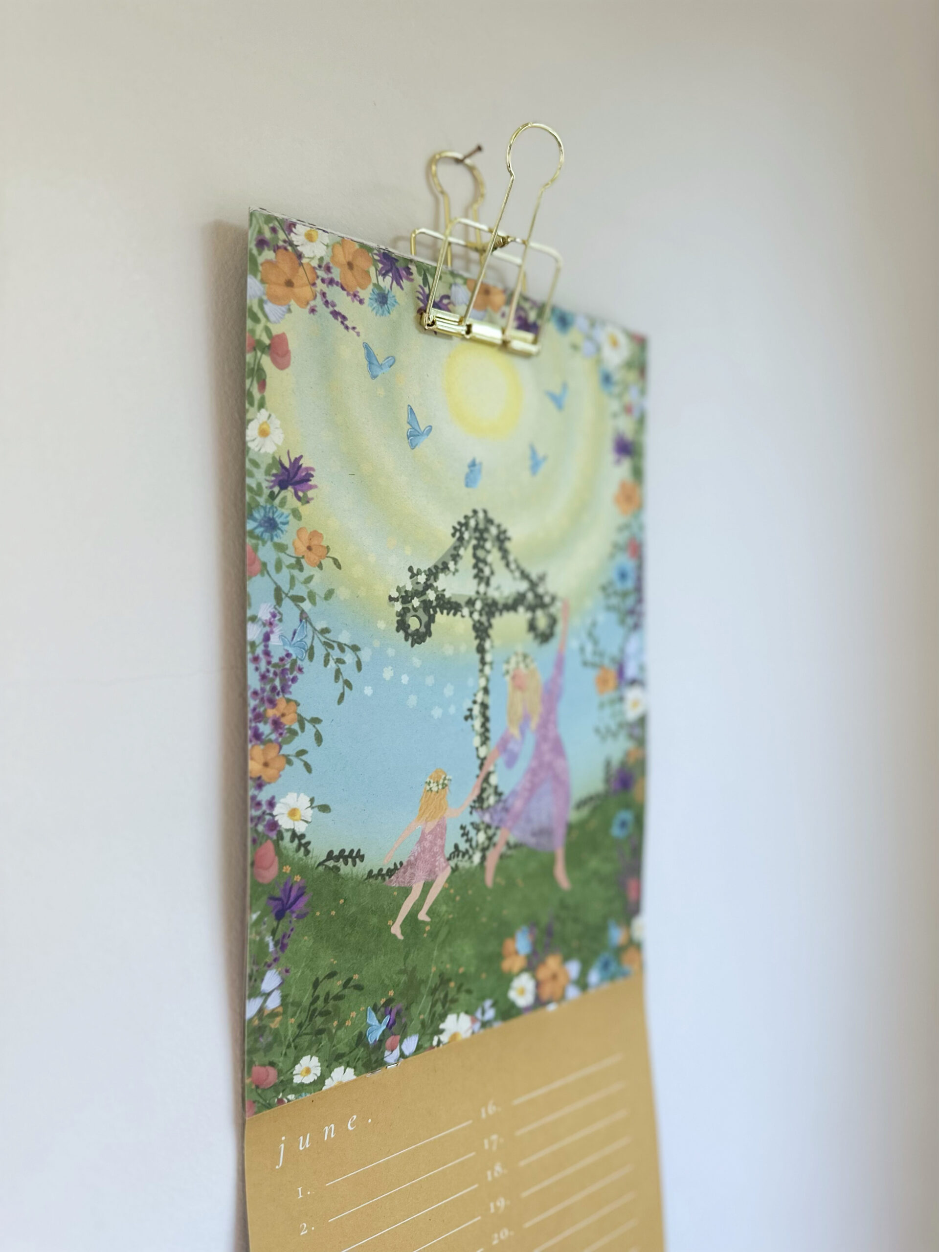 Use a foldable clip to hang my calendars!